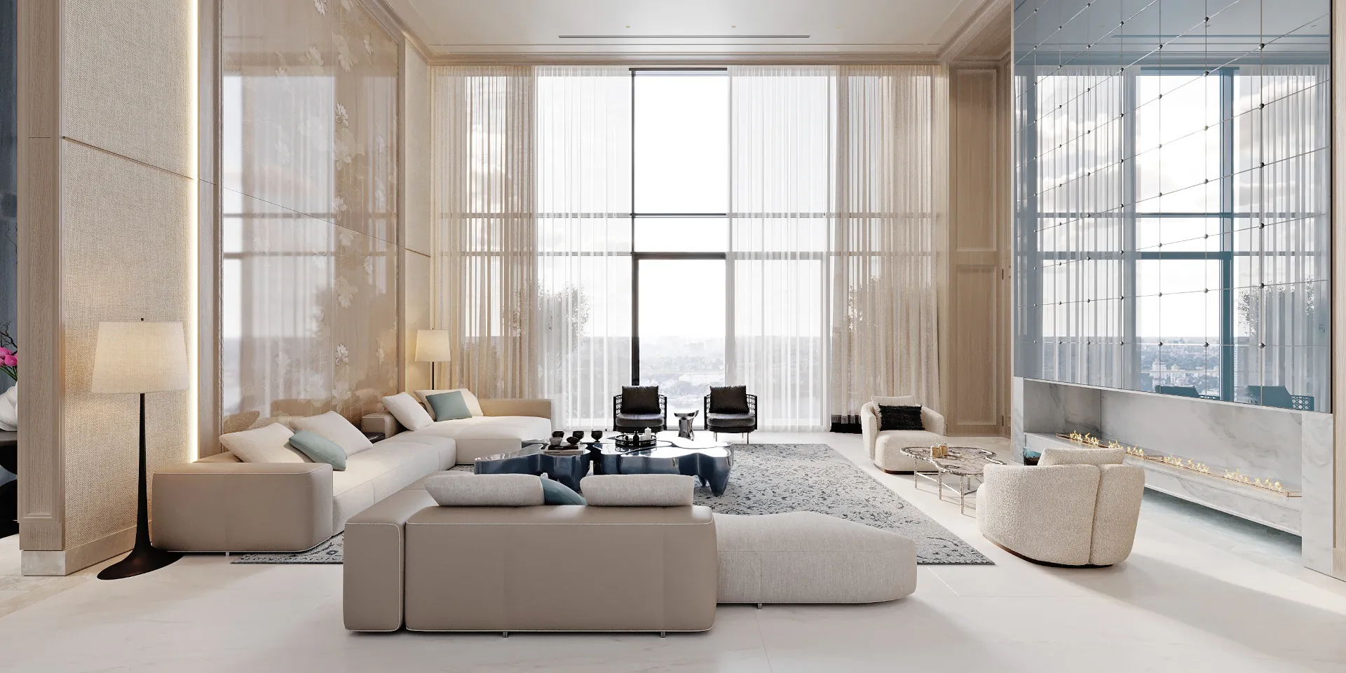 TV lounge: large cream sectional sofa, blue organic coffee table, blue classical‑pattern rug — a cozy yet elegant corner within the open plan.