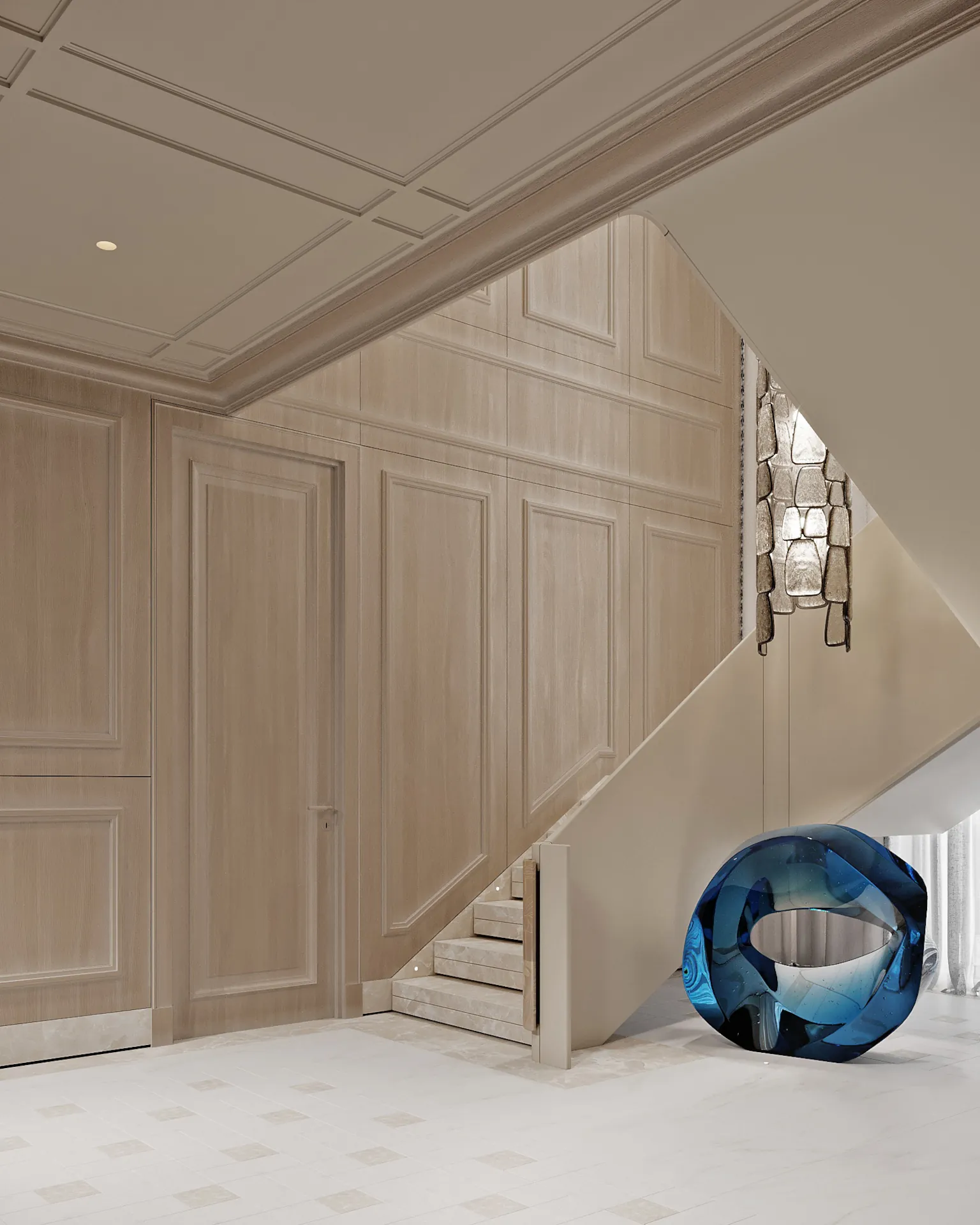 Grand entrance: curved marble staircase with lotus‑engraved balustrades, a sculptural silver‑stone chandelier, blue glass torus sculpture, and light oak panelled walls — luxury defined from the first step.